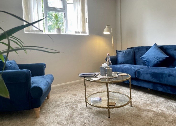 Lisa Bardell’s private therapy room in the City of London, with two blue sofas